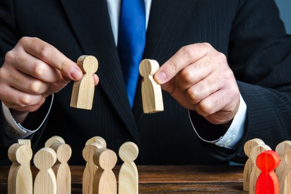 A businessman evaluates candidates for employment.